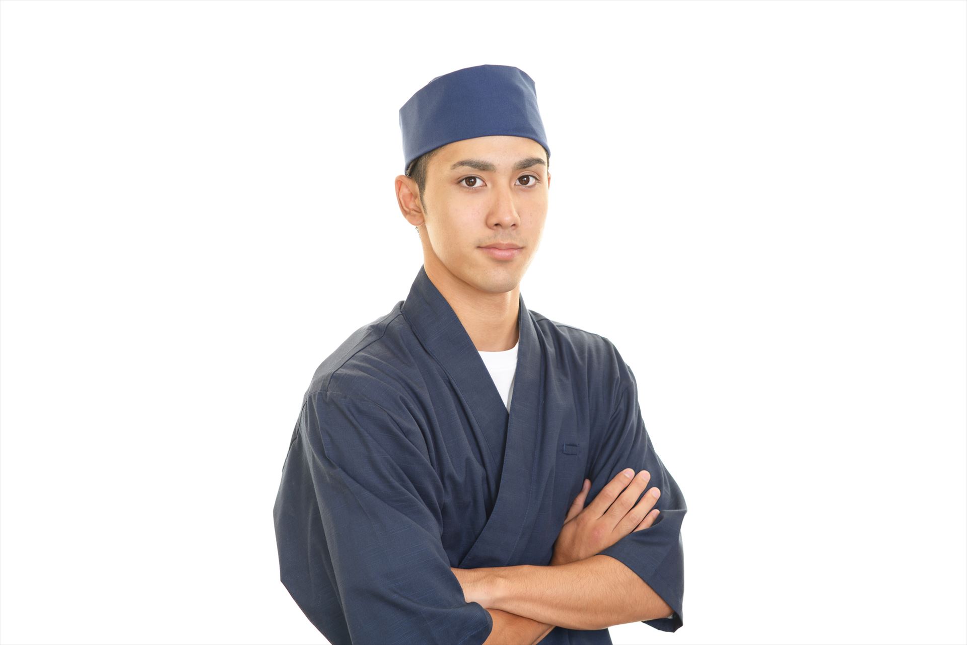 腕を組む寿司職人